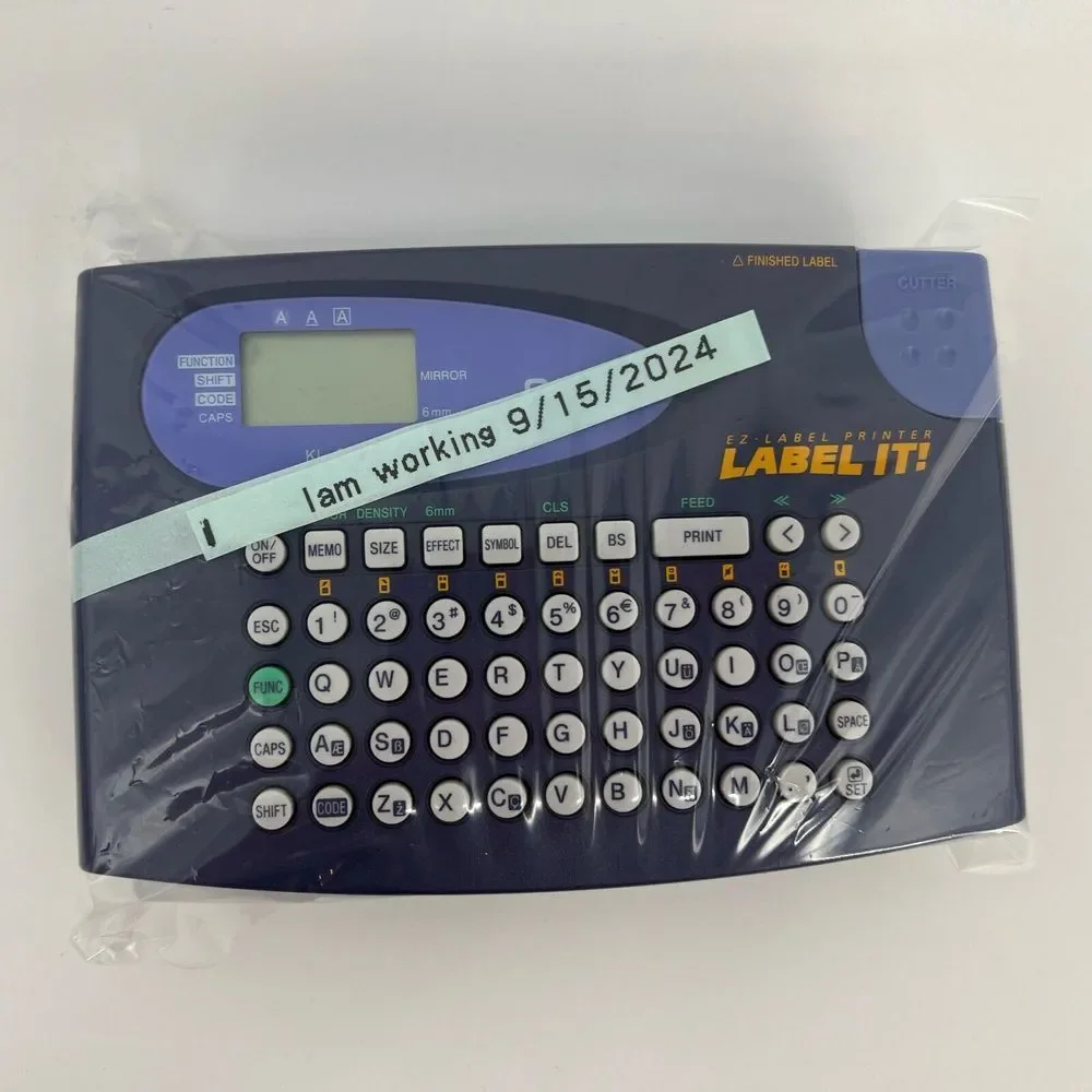 Casio LABEL IT! EZ-Label Printer Model # KL-60-L A Clear Tape Included Inside De